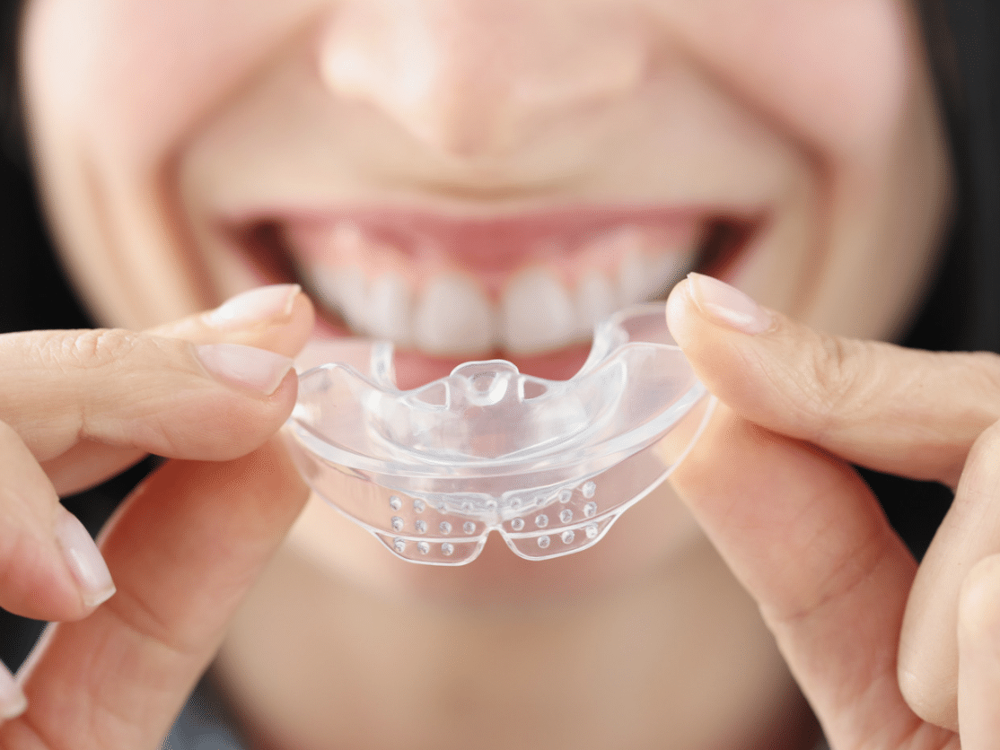 A patient using oral appliance therapy for sleep apnea treatment in Mansfield, TX