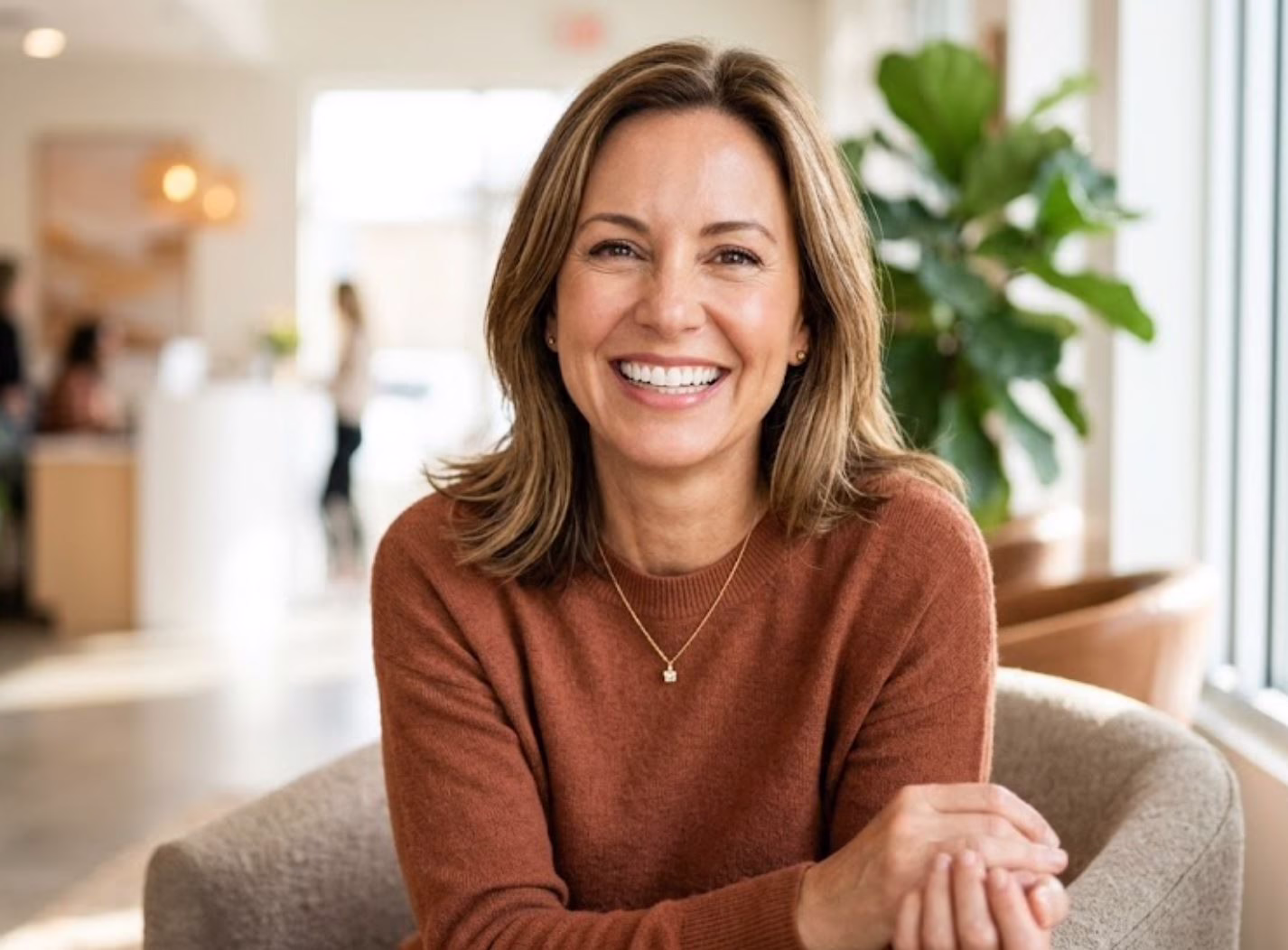 A happy woman smiling confidently to show the benefits of proactive oral health care and regular cancer screenings at Central Park Dental and Orthodontics in Mansfield